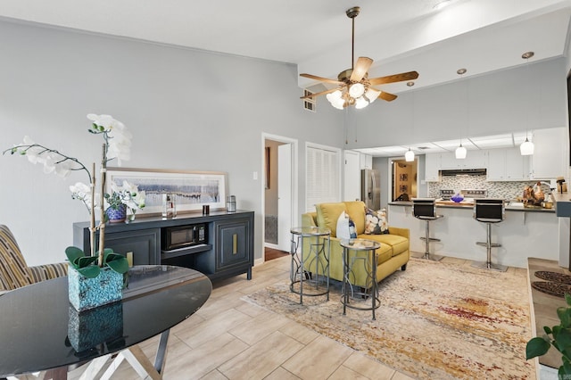 717 Choctaw Cir, Little Rock, AR 72205 - living room with ceiling fan and high vaulted ceiling
