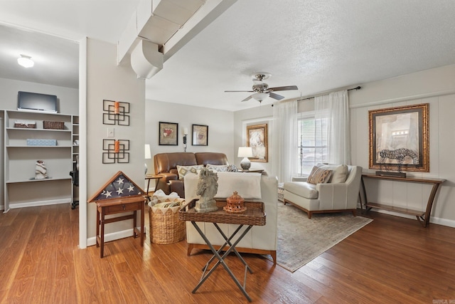 717 Choctaw Cir, Little Rock, AR 72205 - living room featuring wood finished floors, ceiling fan, baseboards, and a textured ceiling