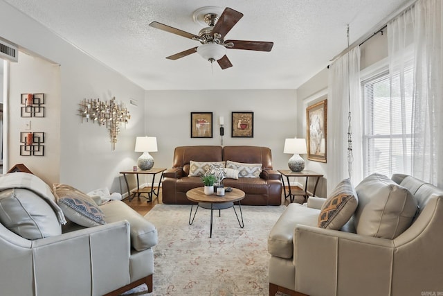 717 Choctaw Cir, Little Rock, AR 72205 - living room with ceiling fan, a textured ceiling, and wood finished floors