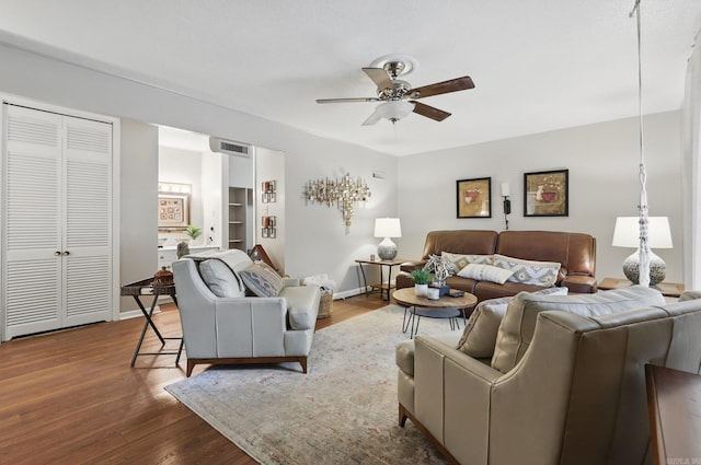 717 Choctaw Cir, Little Rock, AR 72205 - living area featuring a ceiling fan, wood finished floors, and baseboards