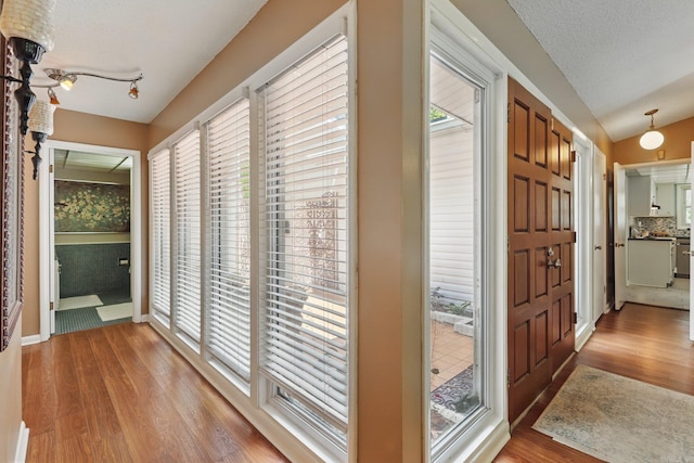 717 Choctaw Cir, Little Rock, AR 72205 - hallway with light wood-type flooring and lofted ceiling