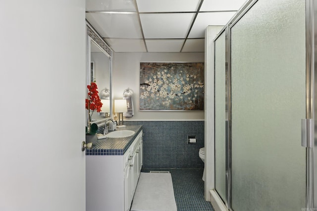 717 Choctaw Cir, Little Rock, AR 72205 - bathroom with toilet, tile patterned floors, a shower stall, vanity, and a drop ceiling