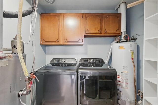 717 Choctaw Cir, Little Rock, AR 72205 - clothes washing area featuring cabinet space, washing machine and clothes dryer, and water heater