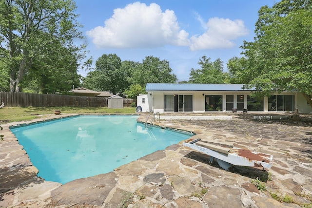 717 Choctaw Cir, Little Rock, AR 72205 - view of swimming pool with a patio, a fenced backyard, a shed, and an outdoor structure