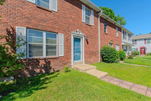 200 Pine Frst Unit F3, Maumelle, AR 72113 - view of front facade featuring a front yard and brick siding