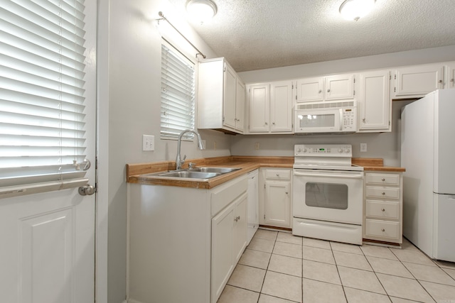 200 Pine Frst Unit F3, Maumelle, AR 72113 - kitchen with white appliances, a sink, a textured ceiling, light tile patterned flooring, and plenty of natural light