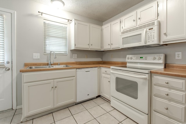 200 Pine Frst Unit F3, Maumelle, AR 72113 - kitchen featuring white appliances, a sink, light tile patterned flooring, white cabinets, and a textured ceiling