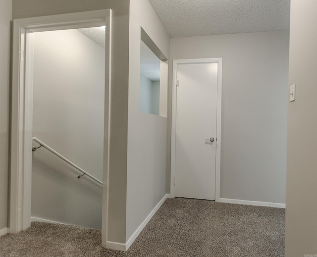 200 Pine Frst Unit F3, Maumelle, AR 72113 - corridor featuring an upstairs landing, carpet, a textured ceiling, and baseboards