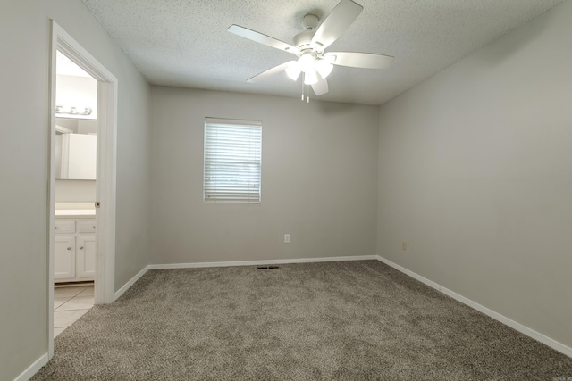 200 Pine Frst Unit F3, Maumelle, AR 72113 - unfurnished room with light carpet, a textured ceiling, a ceiling fan, baseboards, and light tile patterned flooring