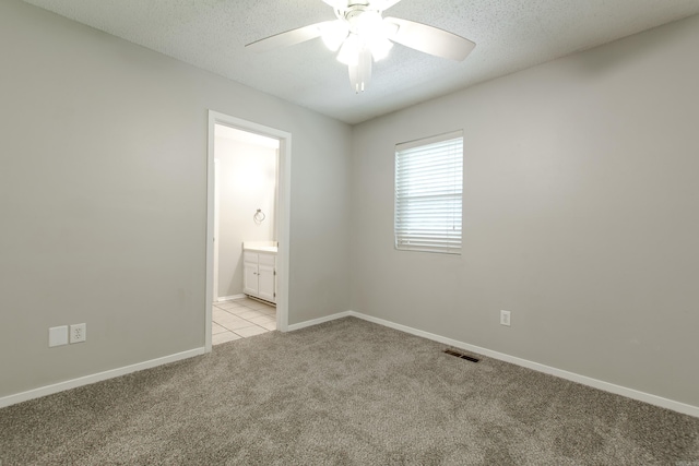200 Pine Frst Unit F3, Maumelle, AR 72113 - spare room with light colored carpet, a ceiling fan, a textured ceiling, and baseboards