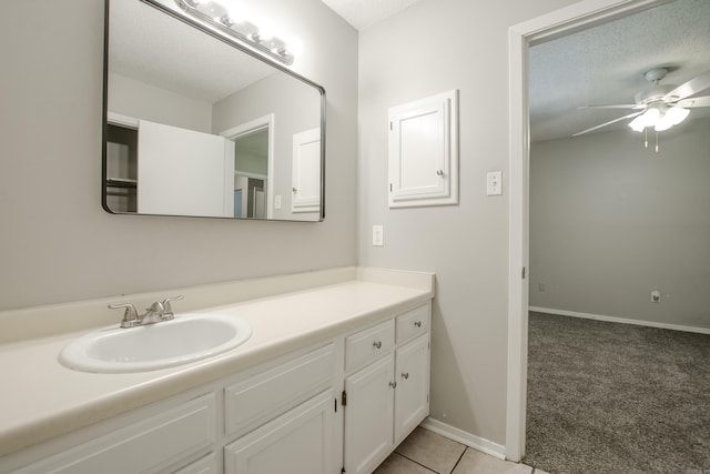 200 Pine Frst Unit F3, Maumelle, AR 72113 - bathroom featuring a ceiling fan, vanity, baseboards, and tile patterned floors