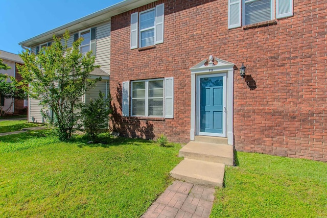200 Pine Frst Unit F3, Maumelle, AR 72113 - view of exterior entry with a lawn and brick siding
