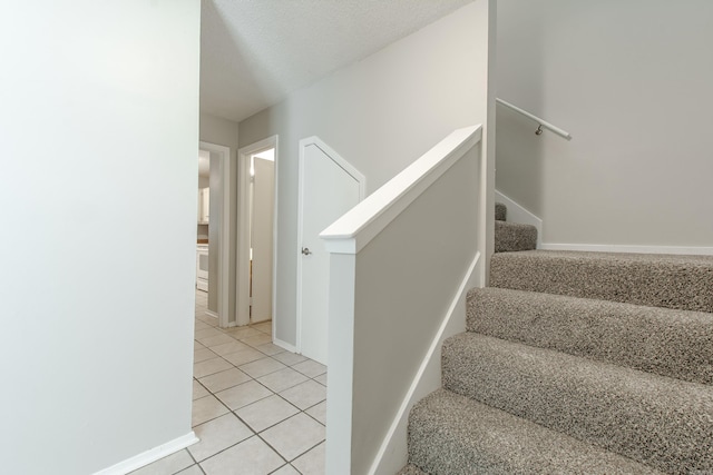 200 Pine Frst Unit F3, Maumelle, AR 72113 - stairway featuring tile patterned flooring and baseboards