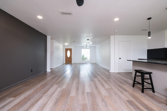 1117 Wild Turkey Ct, Little Rock, AR 72211 - unfurnished living room with light wood-style flooring, recessed lighting, and baseboards