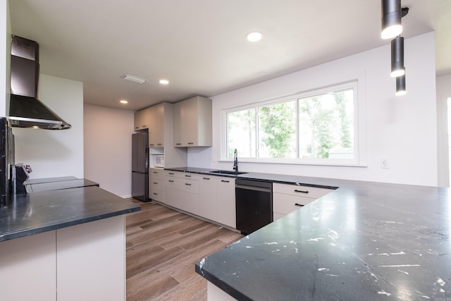 1117 Wild Turkey Ct, Little Rock, AR 72211 - kitchen featuring range hood, a sink, dishwasher, freestanding refrigerator, and light wood finished floors