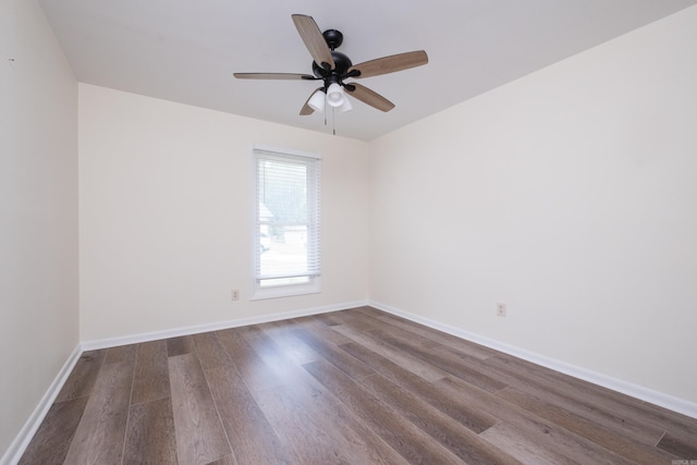 1117 Wild Turkey Ct, Little Rock, AR 72211 - empty room with dark wood finished floors, ceiling fan, and baseboards