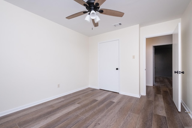 1117 Wild Turkey Ct, Little Rock, AR 72211 - unfurnished bedroom with wood finished floors, baseboards, and ceiling fan