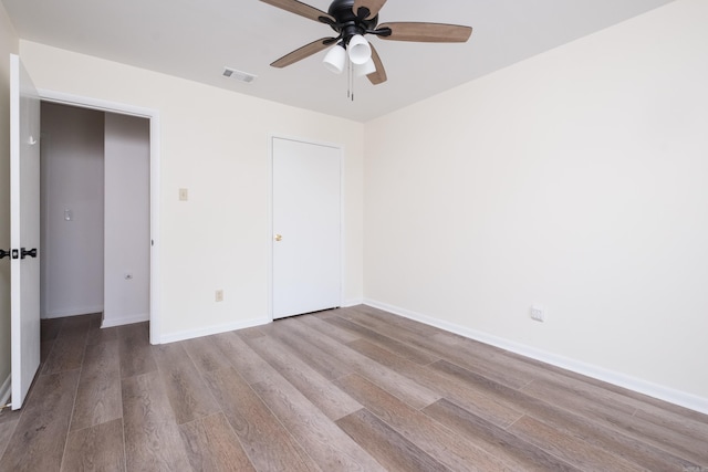 1117 Wild Turkey Ct, Little Rock, AR 72211 - unfurnished bedroom with wood finished floors, baseboards, and ceiling fan