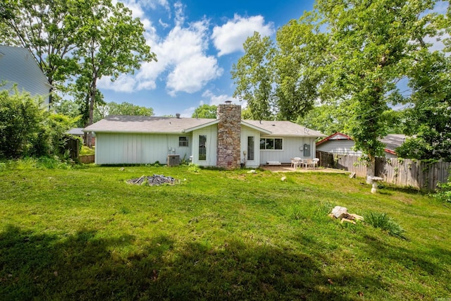 1117 Wild Turkey Ct, Little Rock, AR 72211 - back of house with a chimney, a patio area, and central AC