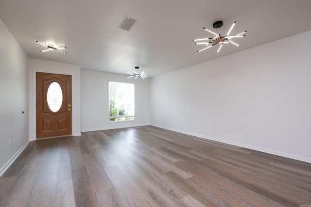 1117 Wild Turkey Ct, Little Rock, AR 72211 - foyer entrance featuring dark wood-style flooring, a chandelier, and baseboards