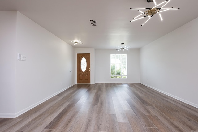 1117 Wild Turkey Ct, Little Rock, AR 72211 - foyer with wood finished floors, a chandelier, and baseboards