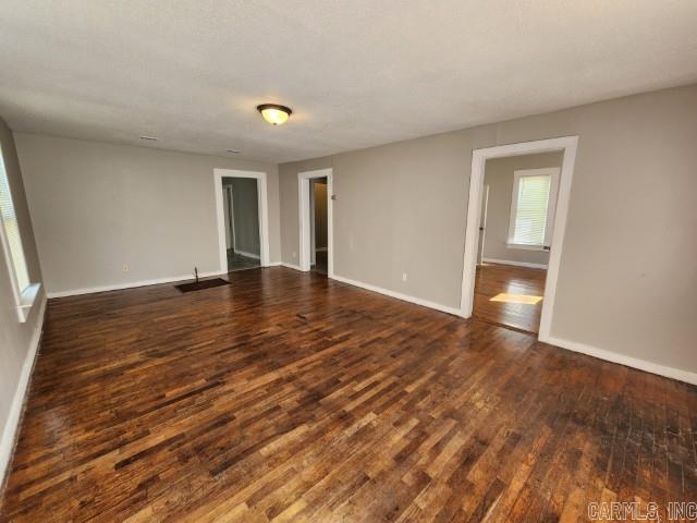 3716 Marion St, North Little Rock, AR 72118 - unfurnished room with dark wood-style floors and baseboards