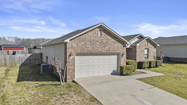 view of front facade featuring brick siding, driveway, a garage, and central air condition unit