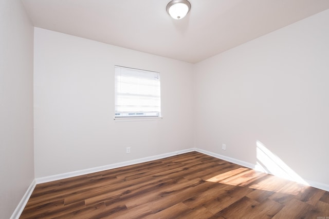 1101 W Charles Bussey Ave, Little Rock, AR 72206 - empty room with dark wood-style flooring and baseboards