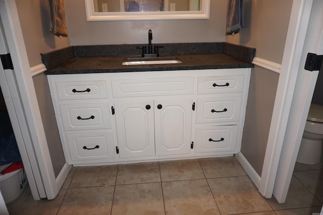 8 Tina Cir, Searcy, AR 72143 - bathroom with toilet, tile patterned floors, vanity, and baseboards