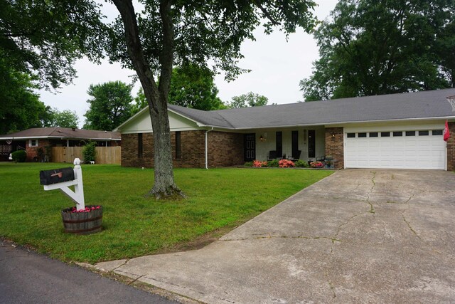 8 Tina Cir, Searcy, AR 72143 - ranch-style home featuring a garage, concrete driveway, and brick siding