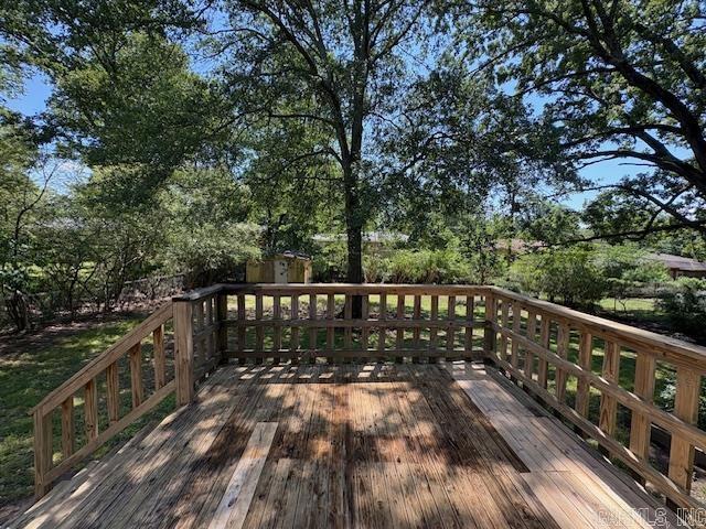 4900 Lochridge Rd, North Little Rock, AR 72116 - deck with a storage unit and an outbuilding