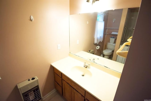 259 Pine Crst, Mountain View, AR 72560 - bathroom with heating unit, toilet, and vanity