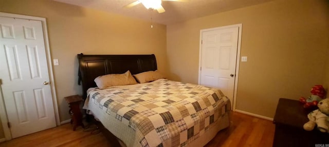 259 Pine Crst, Mountain View, AR 72560 - bedroom with wood finished floors, baseboards, and a ceiling fan