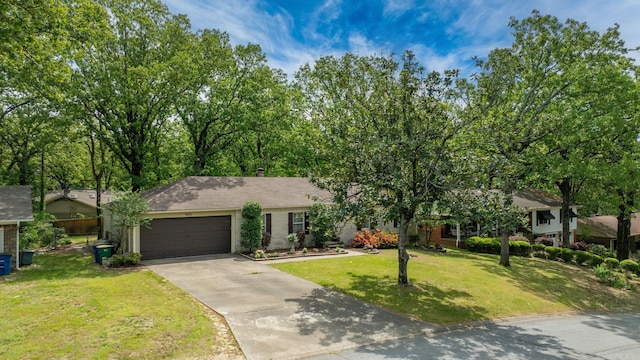 3016 Cleburne Pl, North Little Rock, AR 72116 - view of front of home featuring a garage, concrete driveway, a front yard, and brick siding
