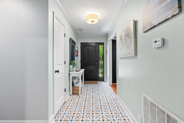 3016 Cleburne Pl, North Little Rock, AR 72116 - entrance foyer featuring baseboards, crown molding, and tile patterned floors