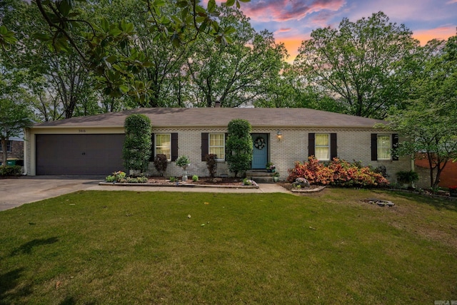 3016 Cleburne Pl, North Little Rock, AR 72116 - ranch-style house featuring brick siding, a garage, driveway, and a front lawn