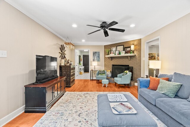 3016 Cleburne Pl, North Little Rock, AR 72116 - living area with light wood-style flooring, ceiling fan, ornamental molding, recessed lighting, and a fireplace