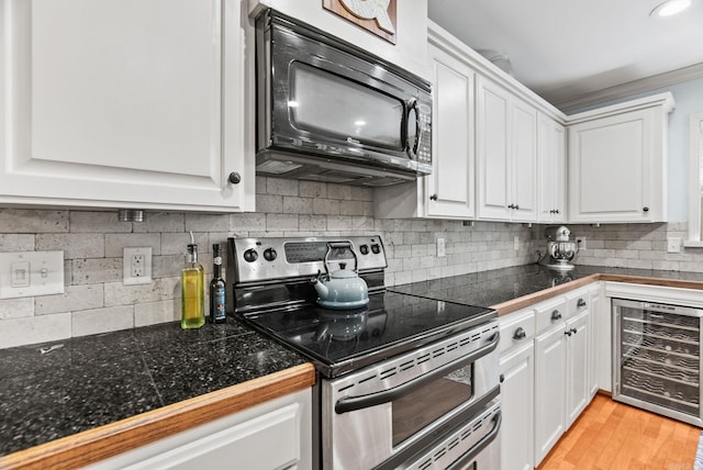 3016 Cleburne Pl, North Little Rock, AR 72116 - kitchen with double oven range, black microwave, beverage cooler, and tile countertops