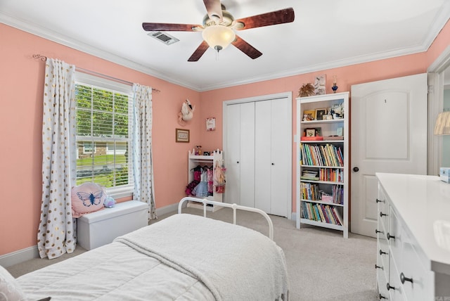 3016 Cleburne Pl, North Little Rock, AR 72116 - bedroom featuring light colored carpet, crown molding, a closet, baseboards, and a ceiling fan