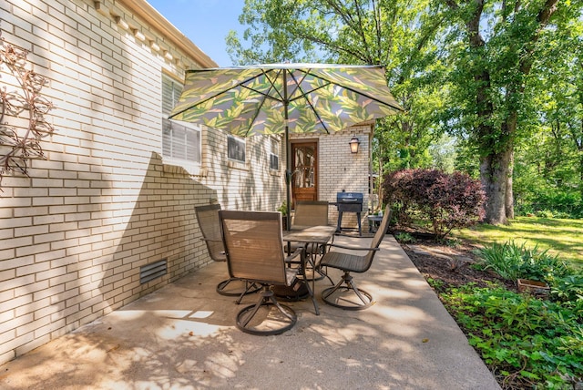 3016 Cleburne Pl, North Little Rock, AR 72116 - view of patio with outdoor dining area and a grill