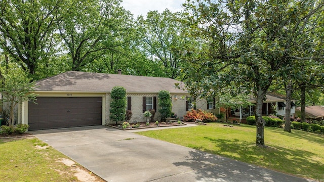 3016 Cleburne Pl, North Little Rock, AR 72116 - view of front of home featuring brick siding, concrete driveway, a garage, a front lawn, and a chimney