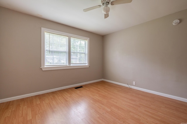 1318-1320 S Summit St, Little Rock, AR 72202 - empty room with light wood-style floors, baseboards, ceiling fan, and a smoke detector