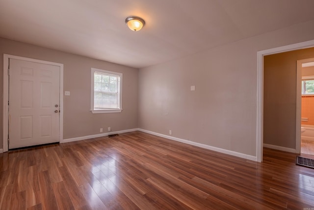 1318-1320 S Summit St, Little Rock, AR 72202 - unfurnished room featuring healthy amount of natural light, wood finished floors, and baseboards