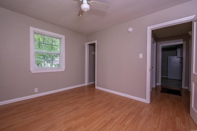 1318-1320 S Summit St, Little Rock, AR 72202 - empty room featuring light wood-style floors, baseboards, ceiling fan, and a smoke detector