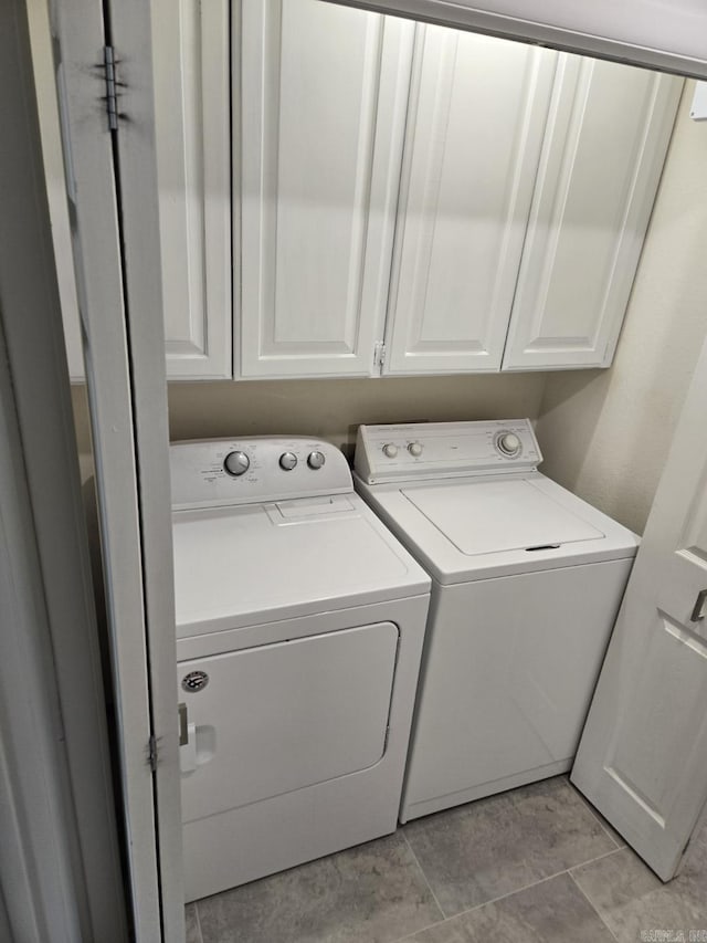 5371 Central Ave Unit C, Hot Springs, AR 71913 - laundry area with washing machine and dryer, cabinet space, and light tile patterned flooring