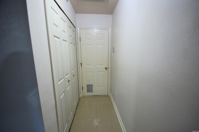 12601 Woodbury Dr, Little Rock, AR 72211 - hall featuring light tile patterned floors and baseboards