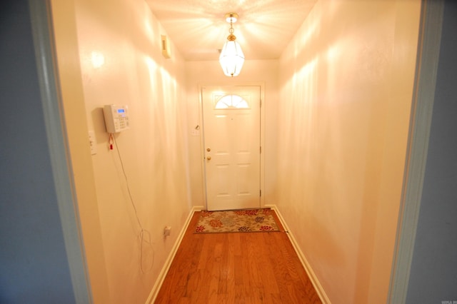 12601 Woodbury Dr, Little Rock, AR 72211 - doorway with wood finished floors and baseboards