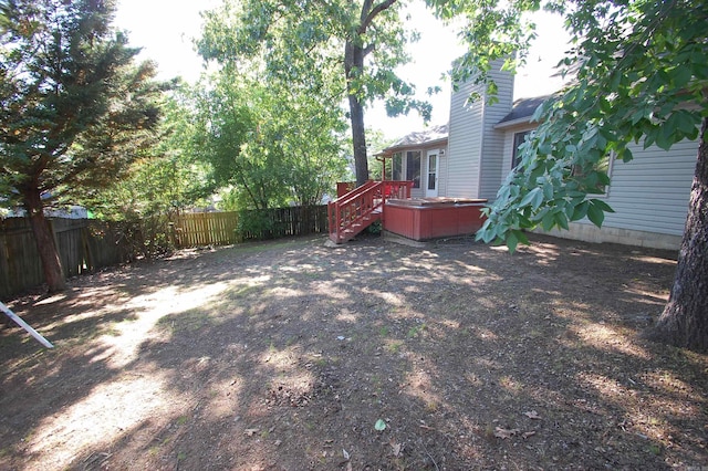 12601 Woodbury Dr, Little Rock, AR 72211 - fenced backyard with a wooden deck