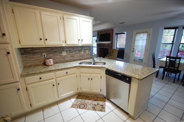 12601 Woodbury Dr, Little Rock, AR 72211 - kitchen with dishwasher, a sink, plenty of natural light, and light tile patterned flooring