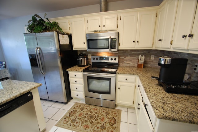 12601 Woodbury Dr, Little Rock, AR 72211 - kitchen with appliances with stainless steel finishes, light tile patterned floors, and light stone counters